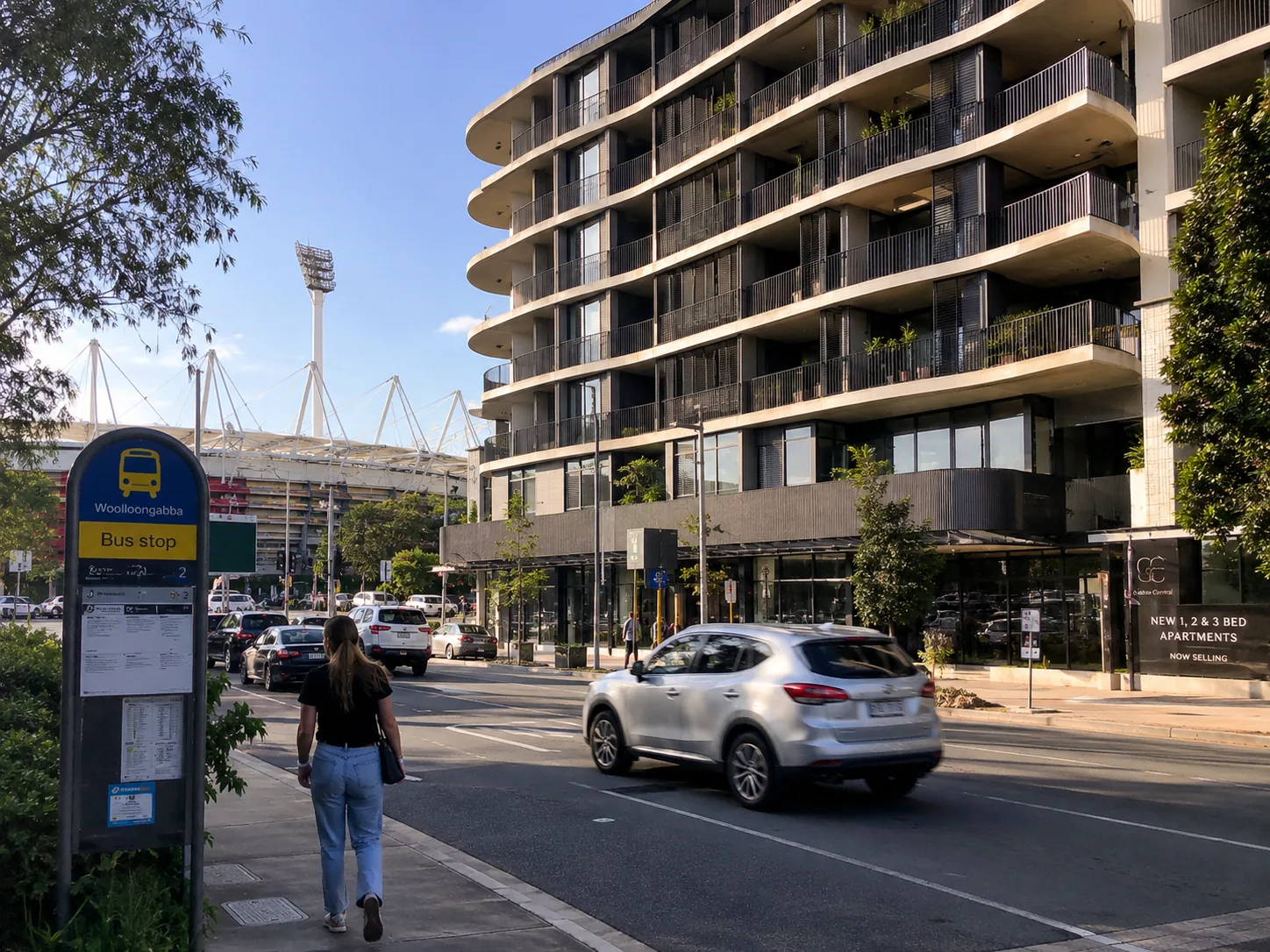 Illustrative generated Woolloongabba street scene with apartment building, stadium and bus stop